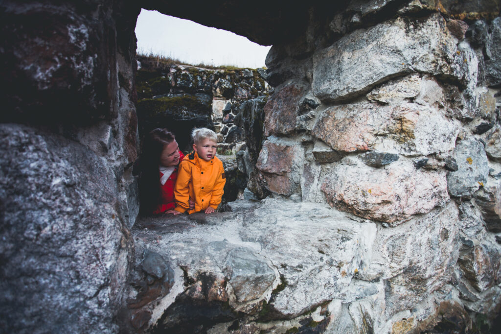 Woman and child looking out from the castle